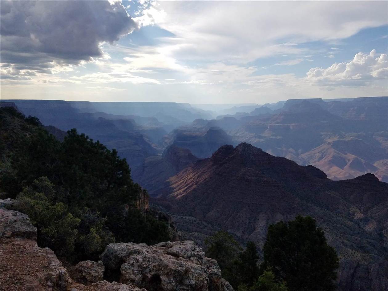 Layered canyon views under a cloudy sky