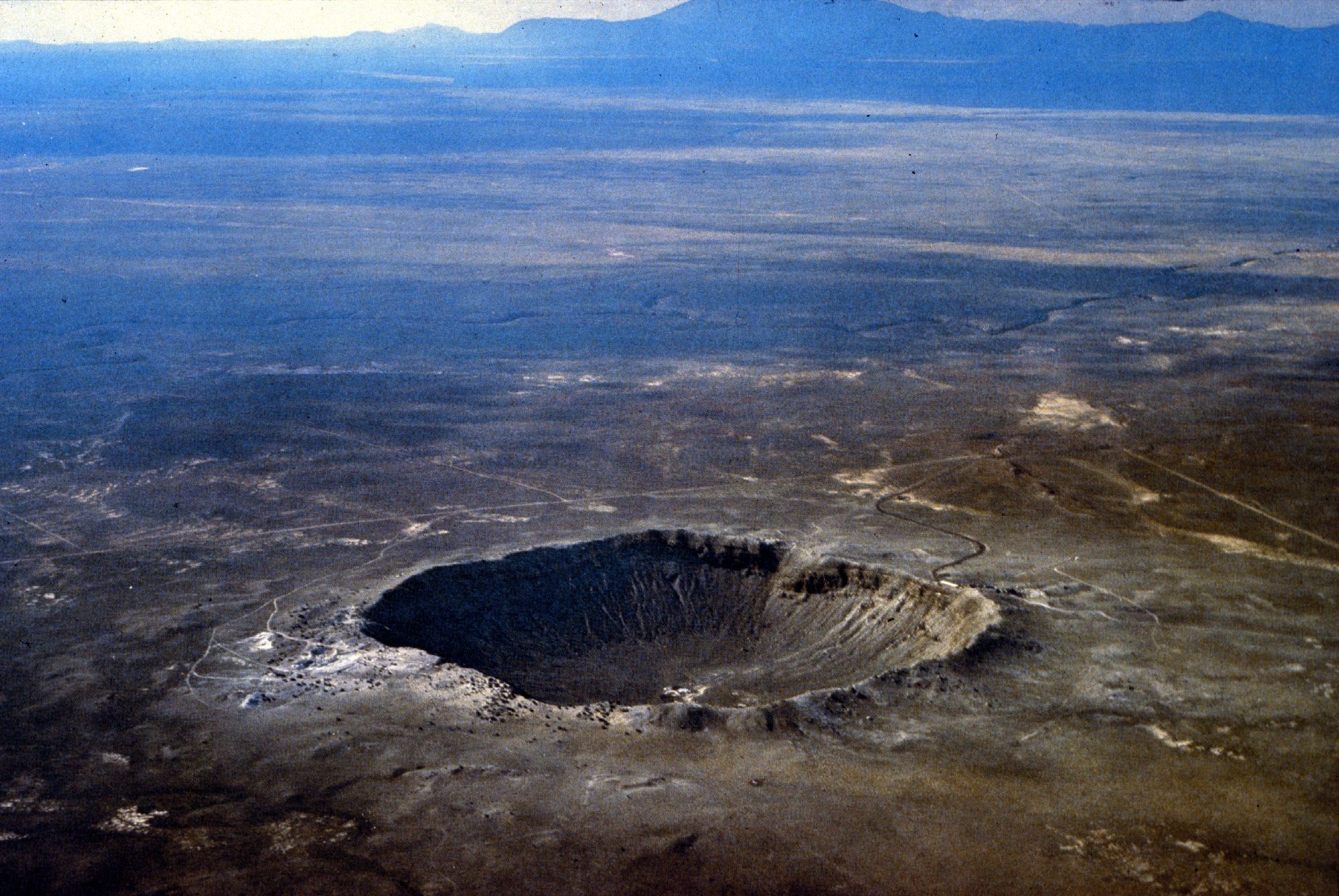 Aerial view of Meteor Crater, a nearly one-mile-wide meteorite impact crater in the northern Arizona desert (USGS photo)