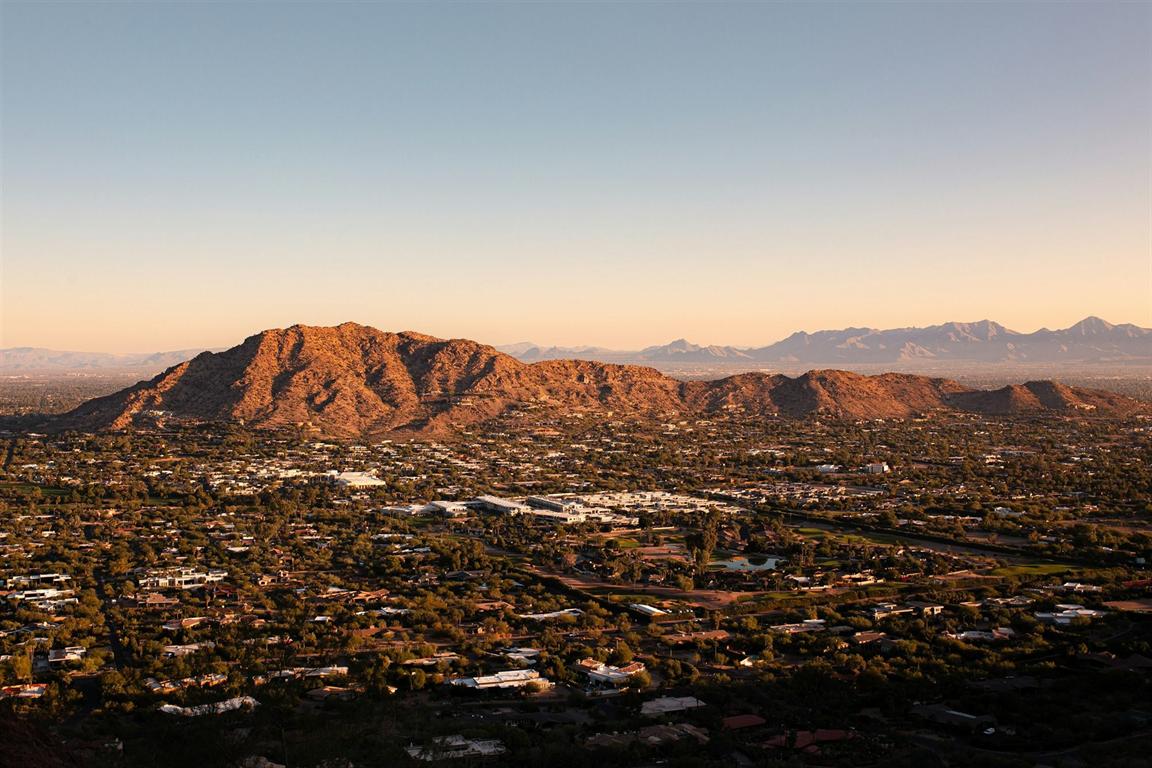 Golden-hour aerial view of desert mountains above a Scottsdale, Arizona resort community