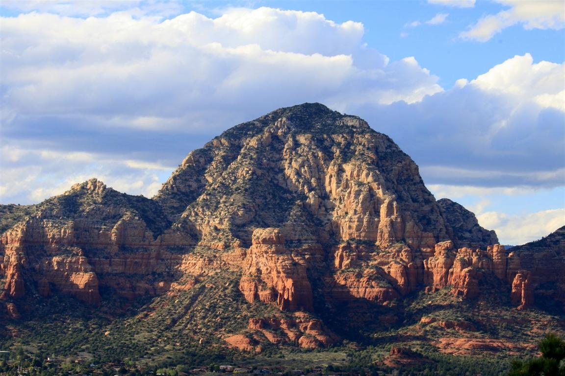 Dramatic red rock peak and clouds near Sedona, Arizona