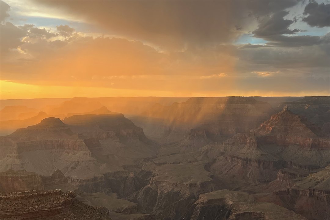Grand Canyon South Rim glowing amber and crimson at sunset